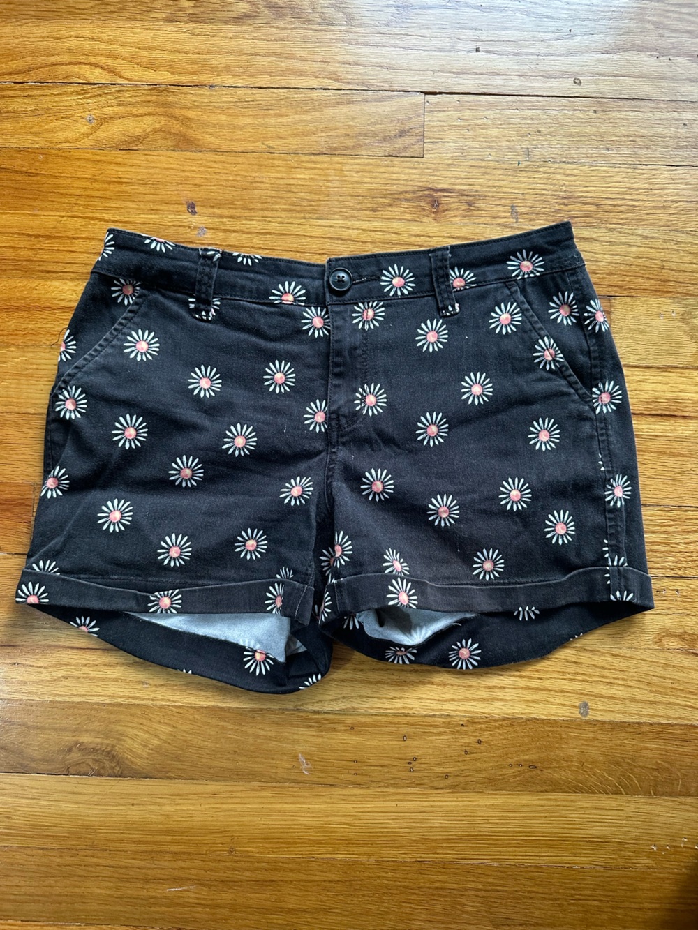 SO Women’s mid\low rise shorts with black daisies. Size 7